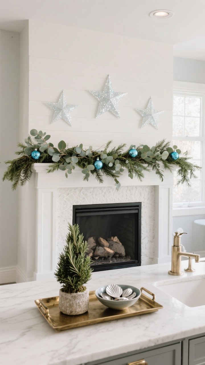 A medium, straight-on mantel and small-spot holiday scene: eucalyptus and cedar garland across the mantel with capiz stars and frosted blue ornaments tucked among greens; below, bathroom/kitchen moment on a small brushed brass tray featuring a rosemary topiary and a small bowl of silvered shells. Rule-of-three groupings, cool winter light with a hint of sparkle, photorealistic.